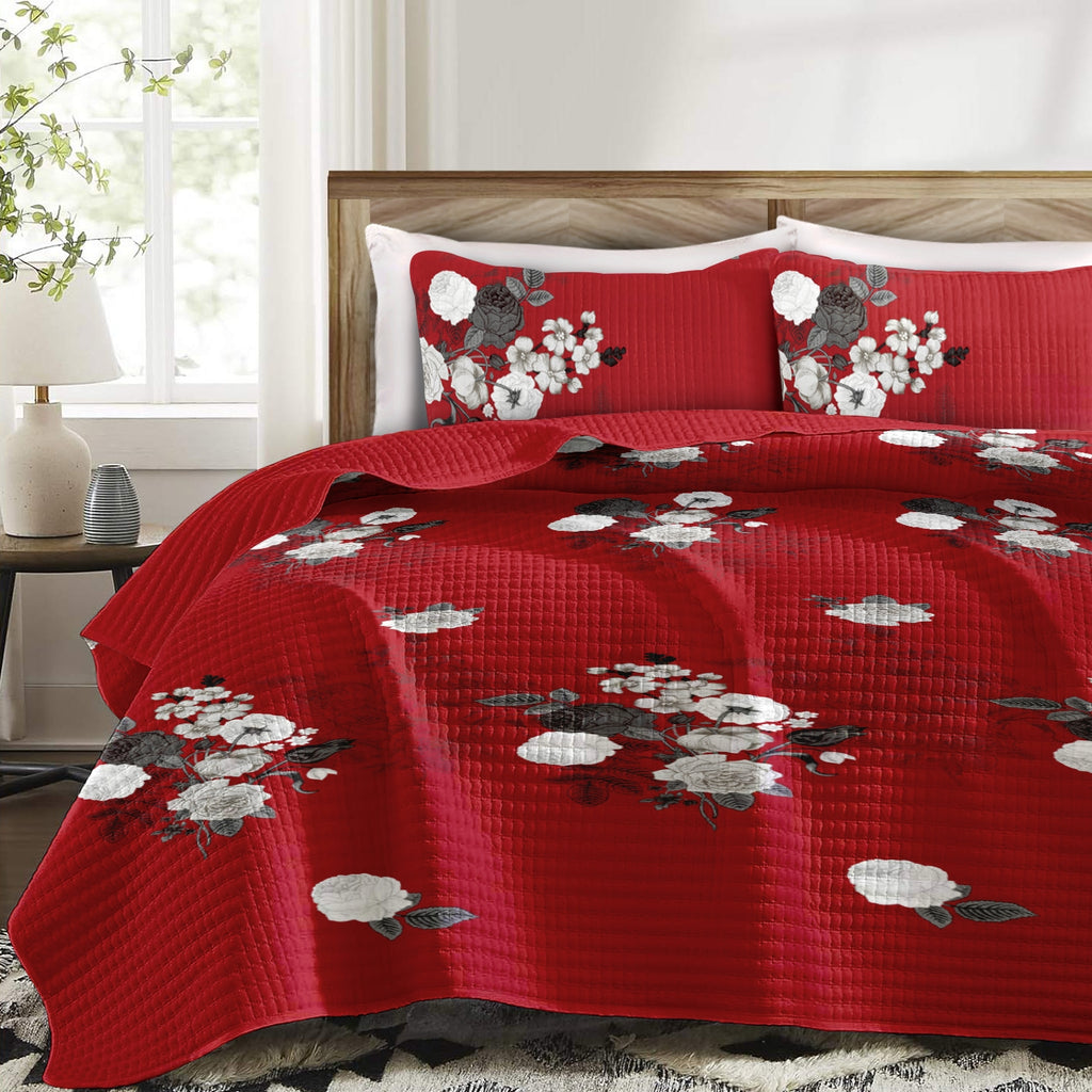 Detalle del acolchado y del estampado floral rojo y blanco